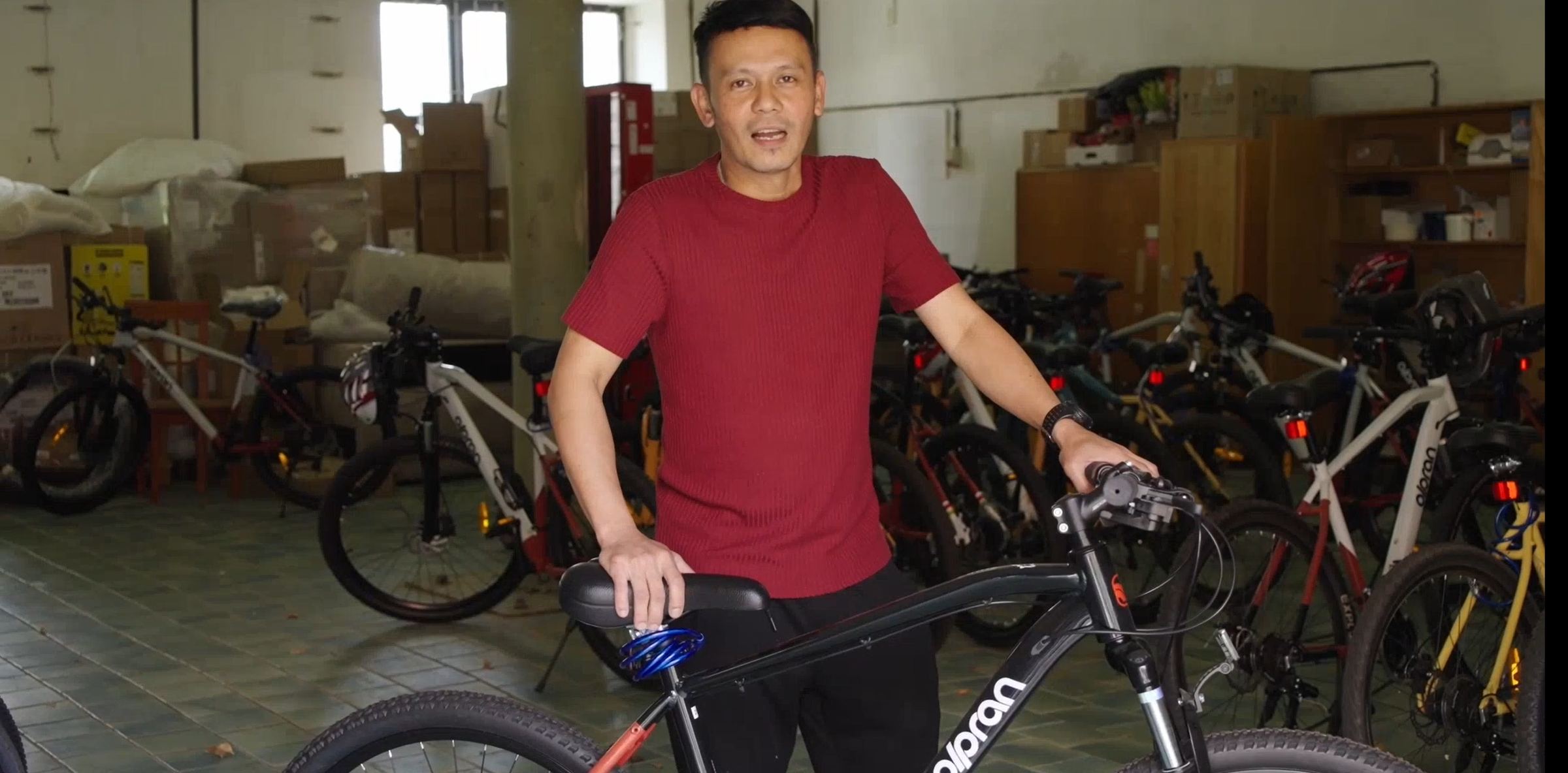 A colleague with his own bike in the bike room at the accommodation